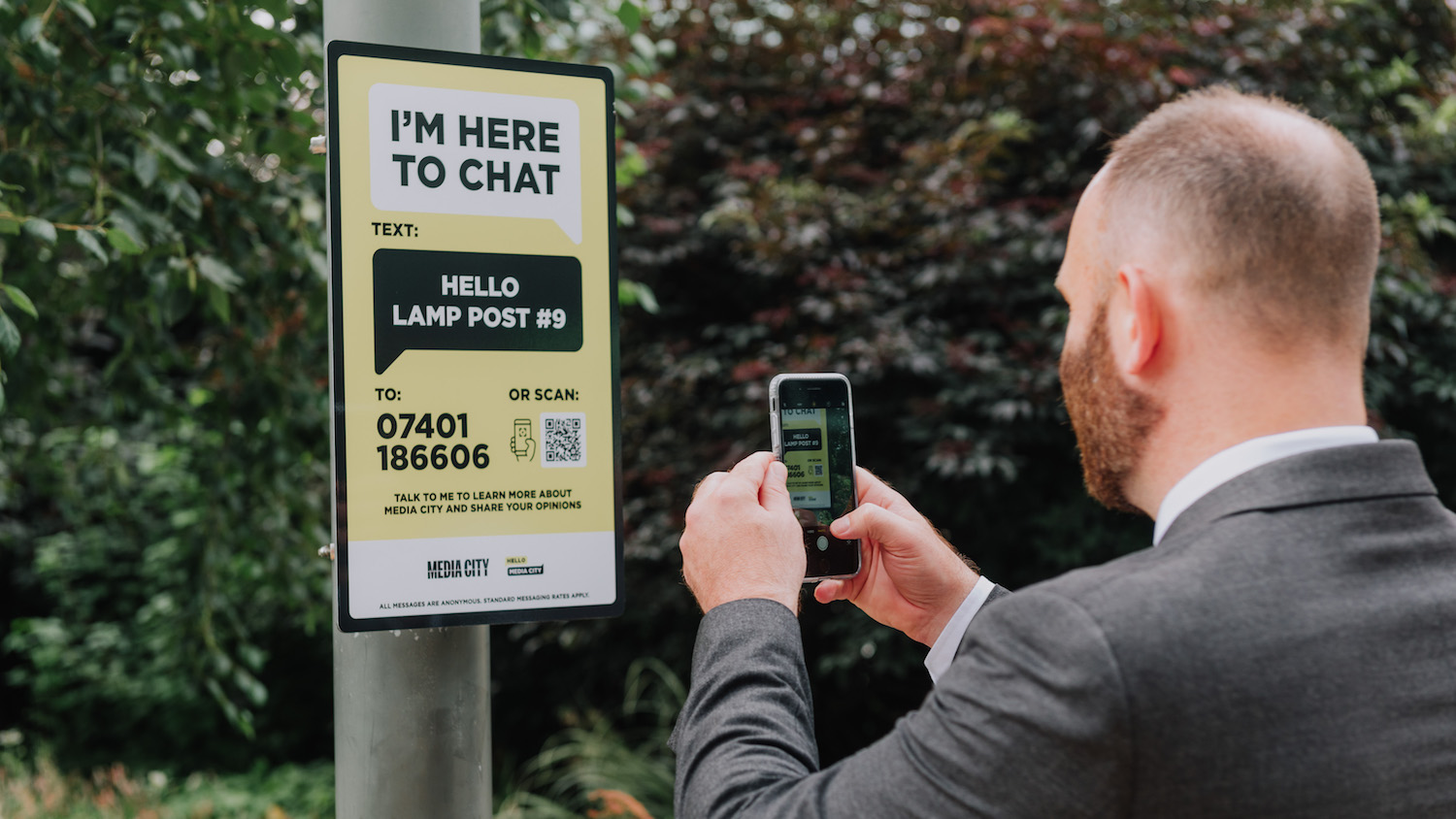 Man using Hello Lamp Post, part of a social housing framework