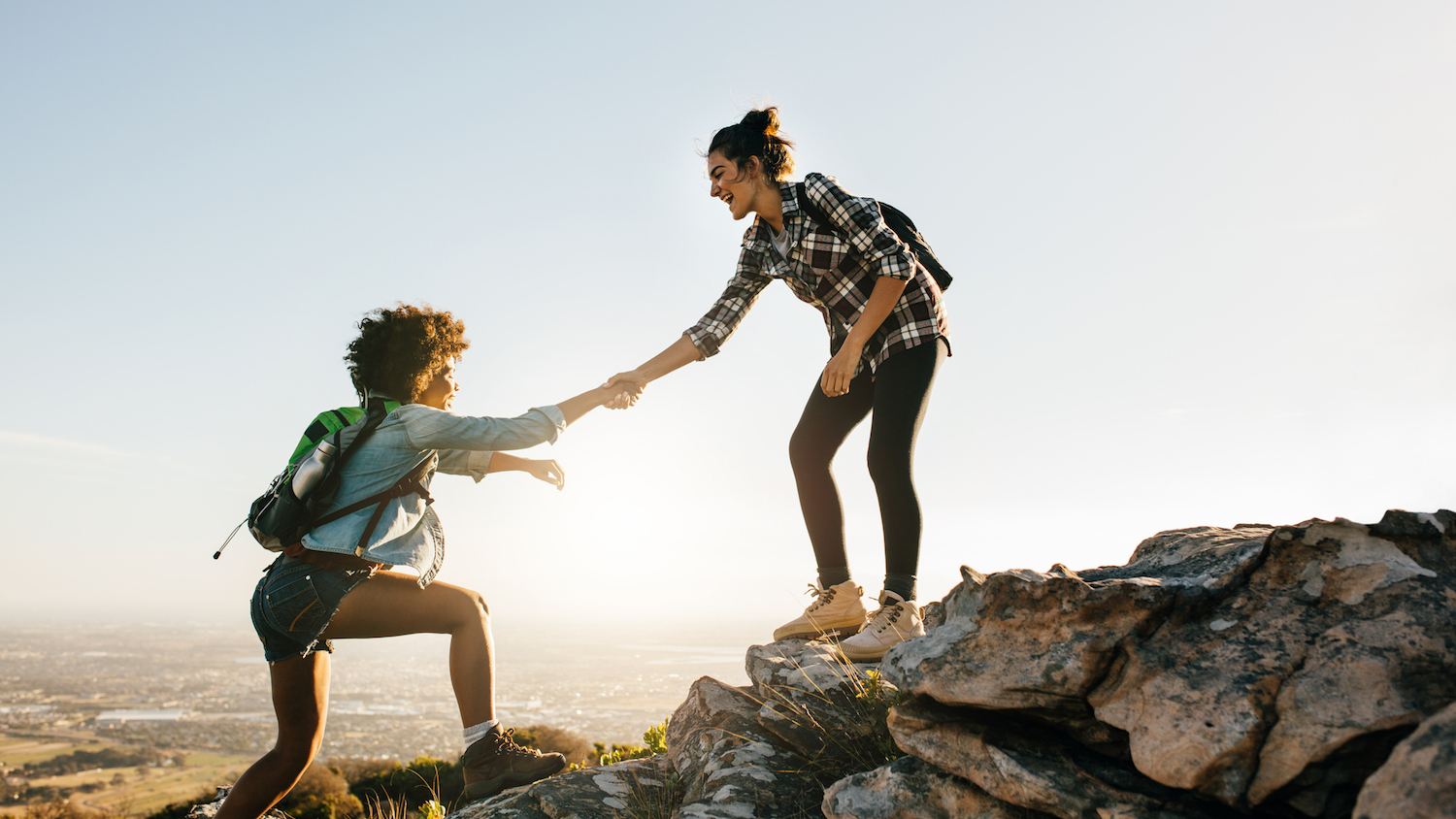 Image of two women climbing to illustrate mentoring