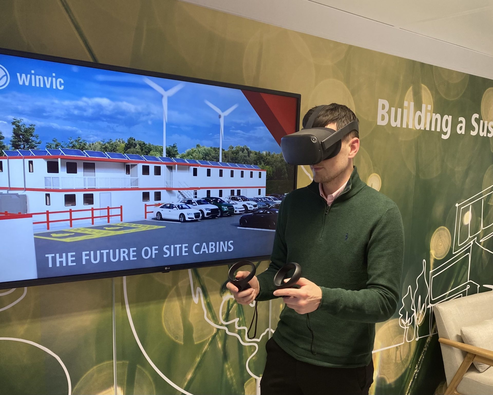 A person using a virtual reality headset in front of a TV.