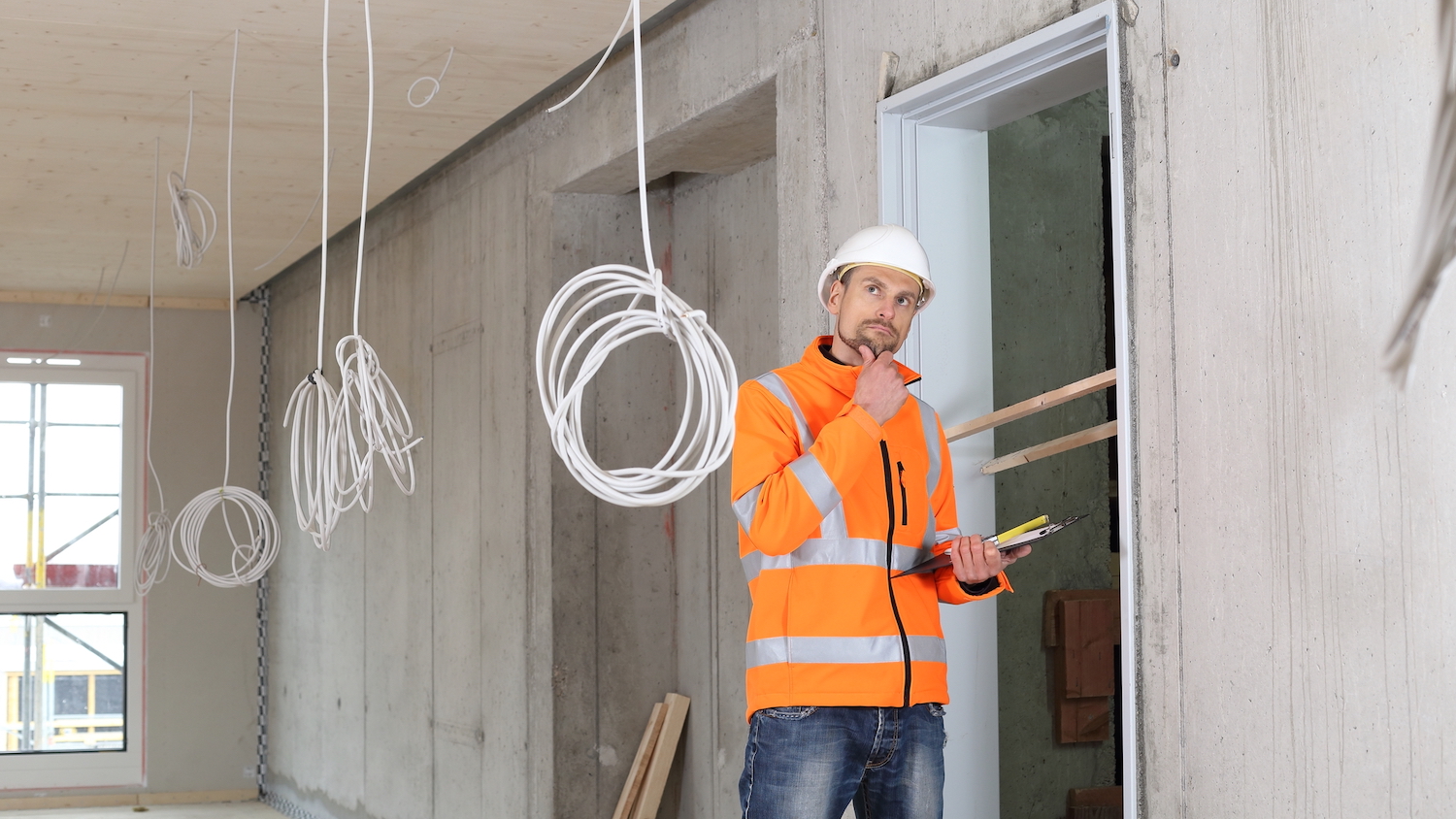 Photo for defect data story: construction professional carrying out snagging