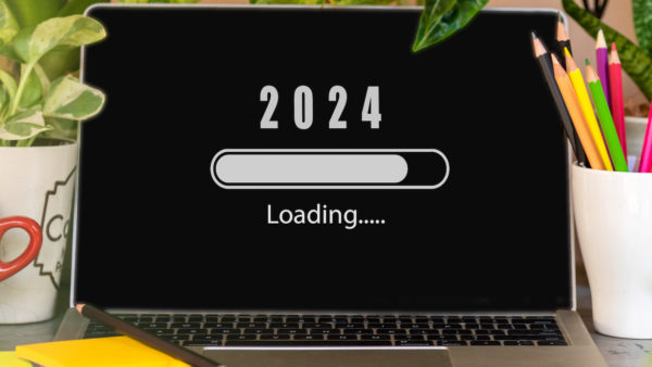 Image of 2024 loading on a laptop - Rhys Lewis Looking back pushing forward