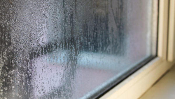 Photo of condensation on a house window to illustrate asset-monitoring innovations story