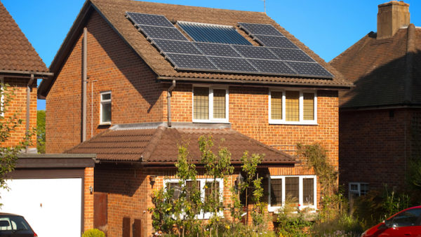 Photo of a home with solar panels for digital skills retrofit story